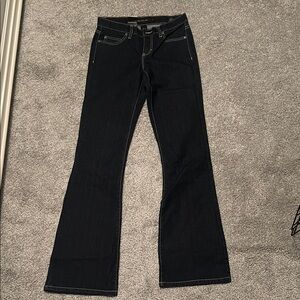 Brand new women’s Calvin Klein slim fit dark denim low rise flared jeans